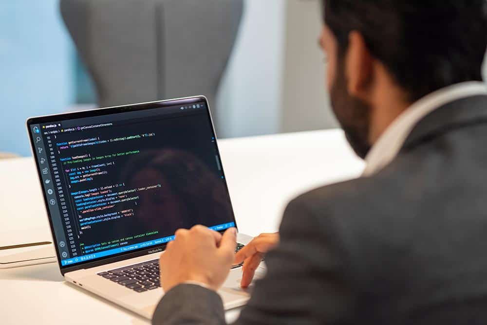 Corporate Photography Reportage - Looking at laptop screen