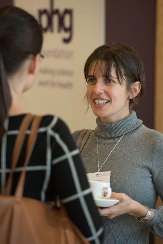 High-quality corporate photography of women networking at business event, professional headshots, building brand image.