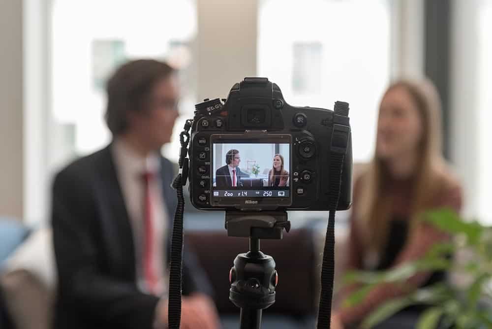 Why Custom Stock Photography Beats Generic Images 9 Professional corporate photography session in a modern office setting.