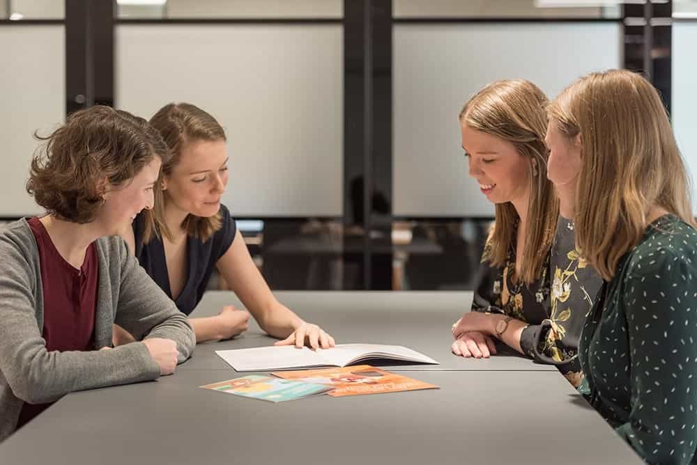 Why Custom Stock Photography Beats Generic Images 2 High-quality corporate photography for business professionals and teams in meeting settings.