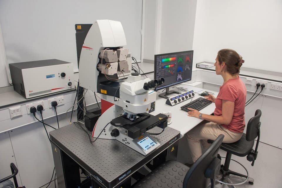 Capturing Innovation: Photography for Research Companies 4 High-tech laboratory scientist working with microscopes and imaging equipment for corporate research.