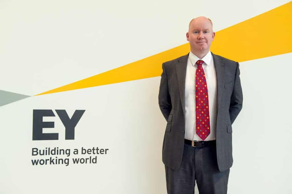 Professional corporate photographer capturing executive headshots for business branding.