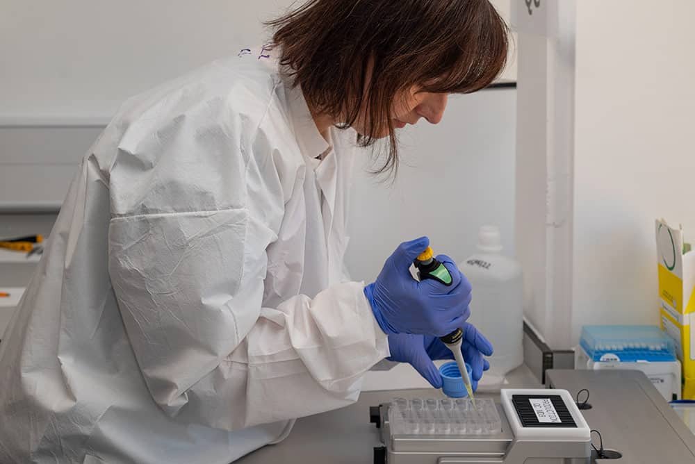 Experienced scientist conducting laboratory research for corporate photography visuals.