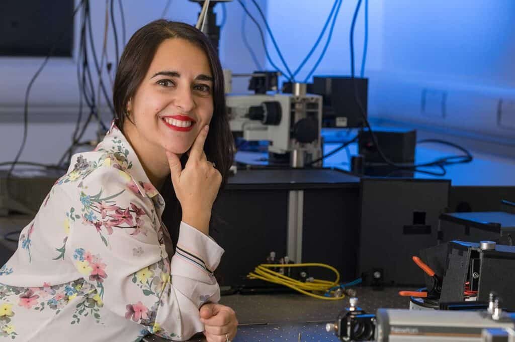 Scientist woman in laboratory with technical equipment, representing professional corporate photography.