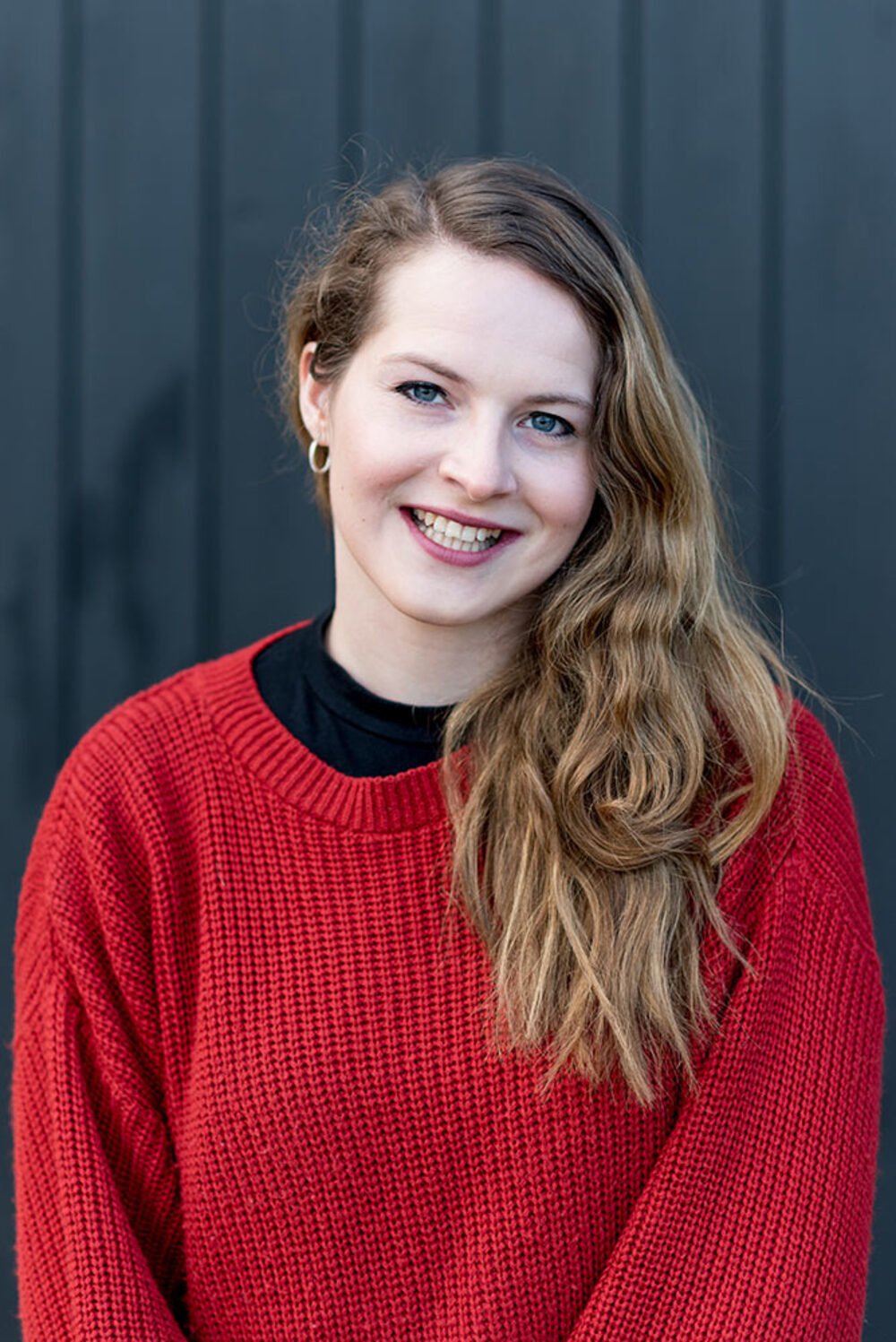 Personal brand portrait against a dark backdrop — Cambridge.